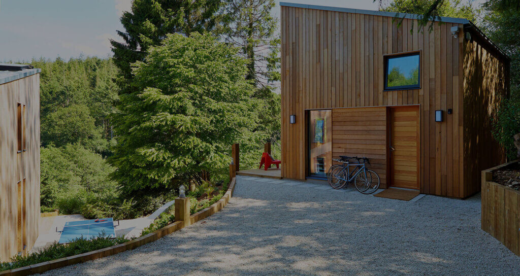 Timber cladding installed vertically and horizontally on a small building