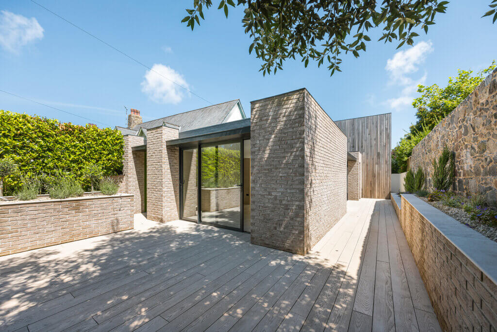 Contemporary development with combined use of brick, British timber cladding, polished plaster and porcelain materials